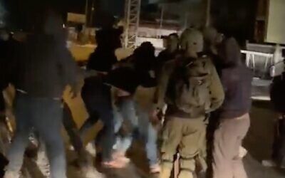 Screen capture from video of Israeli settlers clashing with IDF soldiers in the West Bank Palestinian town of Huwara, October 19, 2022. (Twitter video; used in accordance with Clause 27a of the Copyright Law)