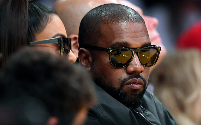 Kanye West watches an NBA basketball game in Los Angeles, January 13, 2020. (AP Photo/Mark J. Terrill)