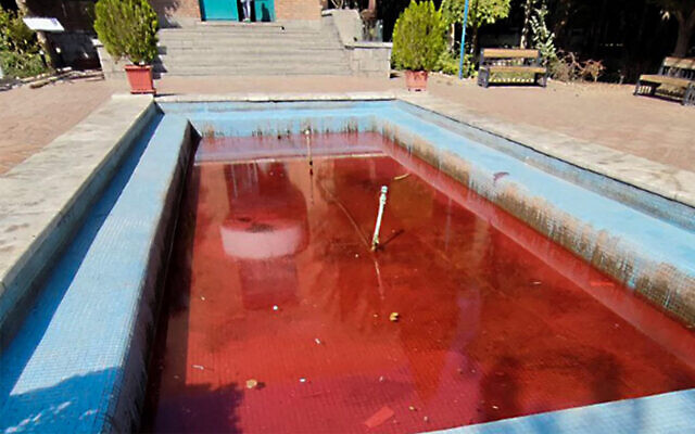 A fountain with its water colored red outside the Artists Forum at Honarmandan Park in the Iranian capital Tehran, October 7, 2022. (AFP)