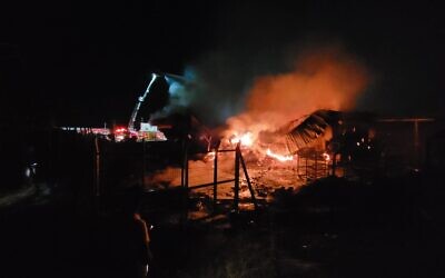 A suspected arson attack destroyed a packaging facility and several tons of produce at the Dor Farm on Moshav Mehola, a settlement in the West Bank, on Tuesday night, October 4, 2022 (Courtesy Moshav Mehola)