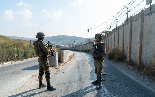 Israeli soldiers are seen at the scene of a shooting near the West Bank settlement of Shavei Shomron, on October 11, 2022. (Israel Defense Forces)