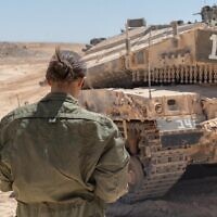 Female soldiers operate a tank in the Negev desert in an undated photograph. (Israel Defense Forces)