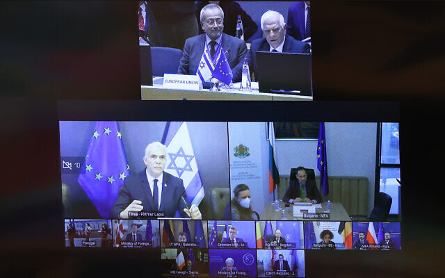 Prime Minister Yair Lapid takes part in a meeting of the EU-Israel Association Council via video from Jerusalem, on October 3, 2022. (EU)