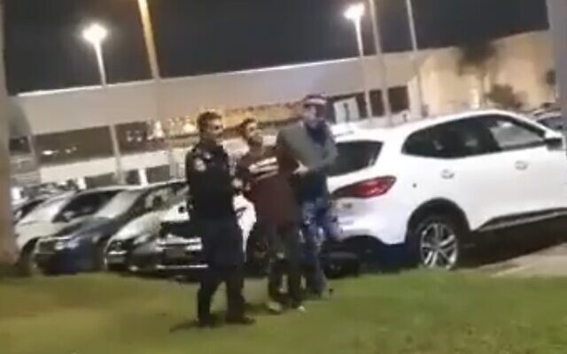 Screen capture from video of a Palestinian resident of the West Bank arrested after crashing a stolen car through the entrance gate at Ben Gurion Airport, October 23, 2022. (Twitter. Used in accordance with Clause 27a of the Copyright Law)