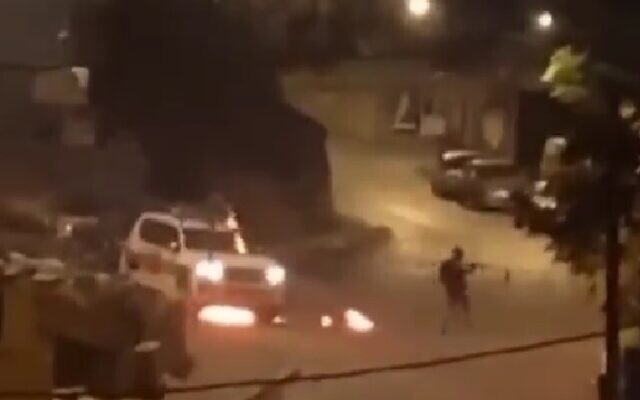 A police car in East Jerusalem surrounded by flames, from footage apparently taken on October 12, 2022. (Screen capture: Twitter; used in accordance with Clause 27a of the Copyright Law)