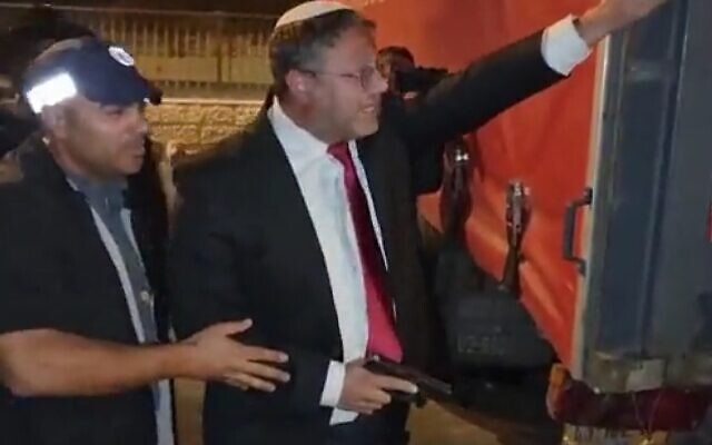 MK Itamar Ben Gvir brandishing a hand gun during clashes in East Jerusalem on October 13, 2022. (Screen capture: Twitter; used in accordance with Clause 27a of the Copyright Law)