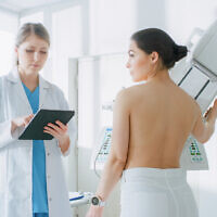 Illustrative image: a woman undergoes a mammogram (gorodenkoff via iStock by Getty Images)