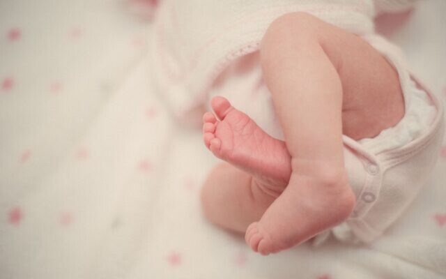 An illustrative photo of a baby in a diaper. (Ignacio Campo on Unsplash)