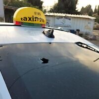 A taxi that was apparently hit by gunfire on a West Bank road, October 2, 2022. (Samaria Regional Council)
