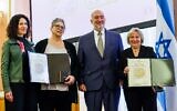 Israel's Ambassador to Germany Ron Prosor (2nd-R) and Berlin's Deputy Mayor Bettina Jarasch (L) present Anne-Marget Schmid (2ndL) and Gundela Suter, descendants and grand-daughters of four German 'Righteous Among the Nations', with medals from Jerusalem's Yad Vashem Holocaust memorial during a posthumous ceremony in their honor at the City Hall of Berlin, on November 2, 2022. (Jens Schlueter/AFP)