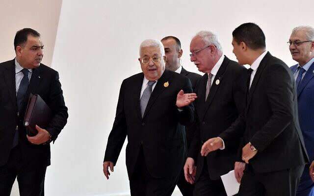 File: Palestinian Authority President Mahmoud Abbas (center), arrives to attend the closing ceremony of Arab summit in the Algerian capital Algiers, on November 2, 2022. (Fethi Belaid / AFP)