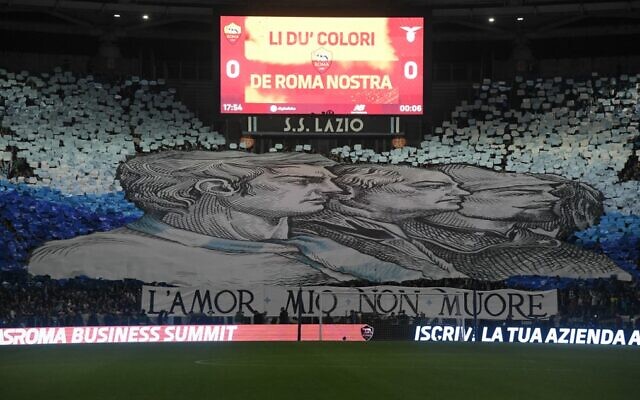 A giant tifo unfurled by Lazio fans, reading "my love will not die." is displayed in a tribune prior to the Italian Serie A soccer match between AS Rome and Lazio on November 6, 2022 at the Olympic stadium in Rome. (Tiziana Fabi/AFP)