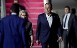 Russia's Foreign Minister Sergey Lavrov (R) arrives to attend the G20 Summit at  Ngurah Rai International airport at Tuban, Badung regency on Indonesia's resort island of Bali, on November 13, 2022. (SONNY TUMBELAKA / POOL / AFP)