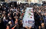 Iranians carry the coffin of one of the people killed in a shooting, during their funeral in the city of Izeh in Iran's Khuzestan province, on November 18, 2022. (Photo by ALIREZA MOHAMMADI / isna / AFP)