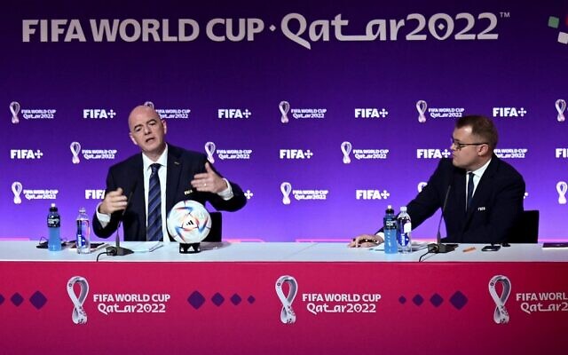 FIFA President Gianni Infantino and Director of Media Relations Bryan Swanson (right) attend a press conference at the Qatar National Convention Center (QNCC) in Doha on November 19, 2022, ahead of the Qatar 2022 World Cup football tournament. (FABRICE COFFRINI/AFP)