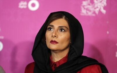 Iranian actress Hengameh Ghaziani poses upon her arrival for a screening during the 34th edition of the Fajr Film Festival at the Milad Tower in Tehran, February 3, 2016. (ATTA KENARE / AFP)