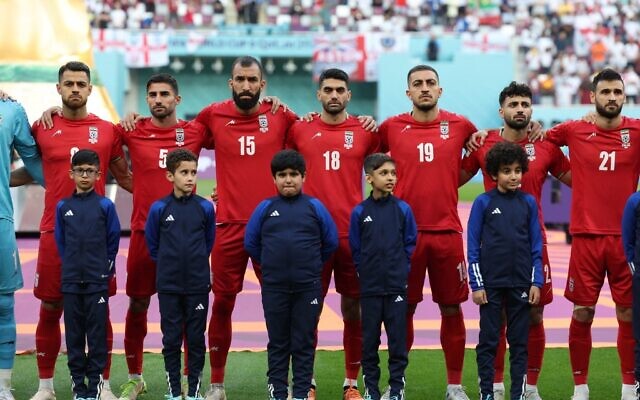 Iran players listen to the national anthem ahead of the Qatar 2022 World Cup Group B football match between England and Iran at the Khalifa International Stadium in Doha on November 21, 2022. (FADEL SENNA / AFP)