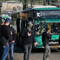 Israeli security forces gather in Jerusalem following an explosion at a bus stop on November 23, 2022. (Menahem KAHANA / AFP)