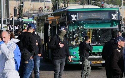 Israeli security forces gather in Jerusalem following an explosion at a bus stop on November 23, 2022. (Menahem KAHANA / AFP)