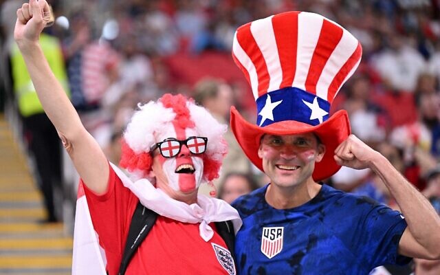 An England and a USA supporter cheer ahead of the Qatar 2022 World Cup Group B football match between England and USA at the Al-Bayt Stadium in Al Khor, north of Doha on November 25, 2022. (Kirill KUDRYAVTSEV / AFP)