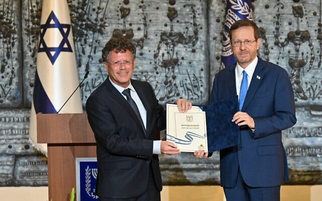 President Isaac Herzog receives the official results of the November 1, 2022 elections from Central Elections Committee chair Justice Yitzhak Amit, November 9, 2022 (President's Residence)