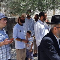 Jewish men pray in a quorum on the Temple Mount in Jerusalem, July 19, 2021. (Jeremy Sharon)