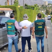 Spanish authorities arrest a man, part of Europol's Operation Desert Light, a multinational bust of a cocaine super-cartel. (YouTube video screenshot: used in accordance with Clause 27a of the Copyright Law)