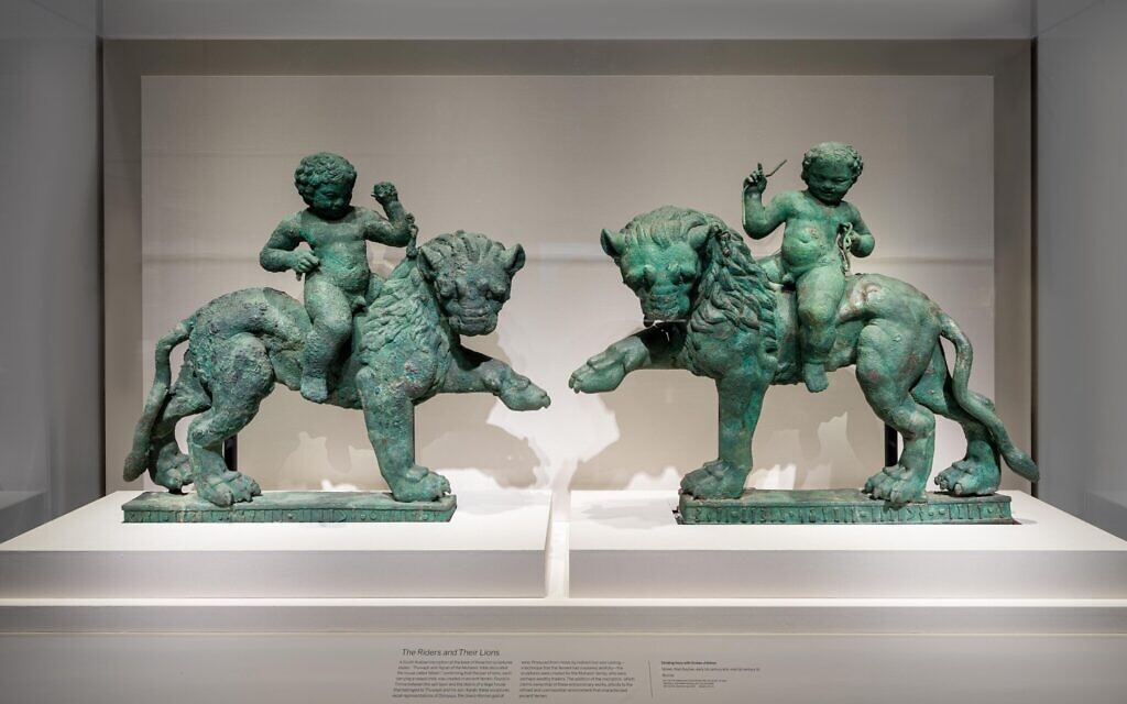 Striding lions with Eros child (pair of two). Early 1st century BCE- mid 1st century CE, Yemen, bronze. (Courtesy of Smithsonian/ Colleen Dugan)