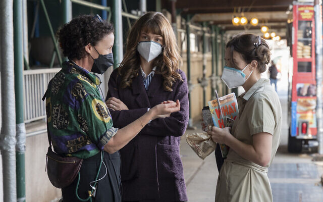 From left: Director Maria Schrader, Megan Twohey (Carey Mulligan) and Jodi Kantor (Zoe Kazan) on the set of 'She Said,' directed by Maria Schrader. (Courtesy Universal Pictures)