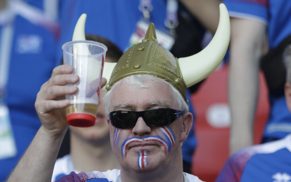 An Iceland fan toasts with a beer prior to the group D match between Argentina and Iceland at the 2018 soccer World Cup in the Spartak Stadium in Moscow, Russia, Saturday, June 16, 2018. (AP Photo/Matthias Schrader)