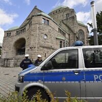 Police secure the old synagogue in Essen, Germany, Oct. 10, 2019. (AP Photo/Martin Meissner)