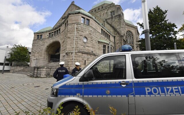 Police secures the old synagogue in Essen, Germany, Thursday, Oct. 10, 2019. (AP Photo/Martin Meissner)
