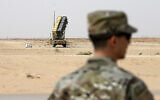 Illustrative: In this February 20, 2020, file pool photo, a member of the US Air Force stands near a Patriot missile battery at Prince Sultan Air Base in Saudi Arabia. (Andrew Caballero-Reynolds/Pool via AP)