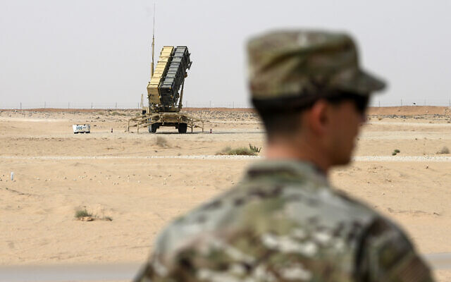 Illustrative: In this February 20, 2020, file pool photo, a member of the US Air Force stands near a Patriot missile battery at Prince Sultan Air Base in Saudi Arabia. (Andrew Caballero-Reynolds/Pool via AP)