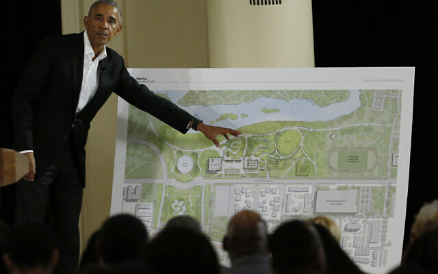 Former President Barack Obama points to a rendering for the former president's lakefront presidential center at a community event at the South Shore Cultural Center in Chicago on May 3, 2017. (AP/Nam Y. Huh, File)