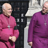 Archbishop of York Stephen Geoffrey Cottrell, left, and The Archbishop of Canterbury Justin Welby walk in central London, Sept. 14, 2022 ahead of the ceremonial procession of the coffin of Queen Elizabeth II, from Buckingham Palace to Westminster Hall, London. (Justin Tallis/Pool Photo via AP)