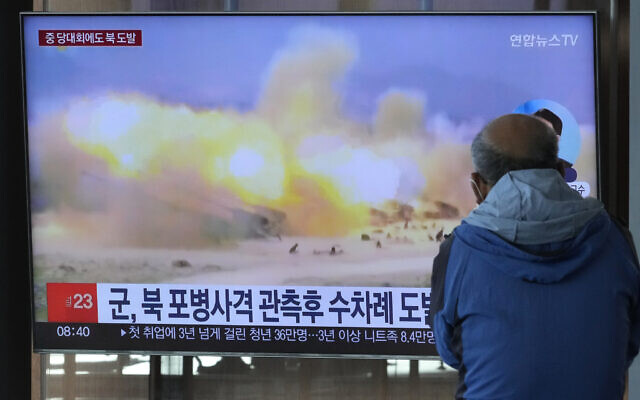 A TV screen shows a file image of North Korea's military exercise during a news program at the Seoul Railway Station in Seoul, South Korea, Wednesday, Oct. 19, 2022. (AP/Ahn Young-joon)