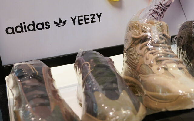 A sign advertises Yeezy shoes made by Adidas at Kickclusive, a sneaker resale store, in Paramus, New Jersey Oct. 25, 2022 (AP Photo/Seth Wenig)