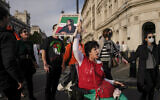 Demonstrators take part in a protest against Iranian authorities, in London, October 29, 2022. (AP Photo/Alberto Pezzali)