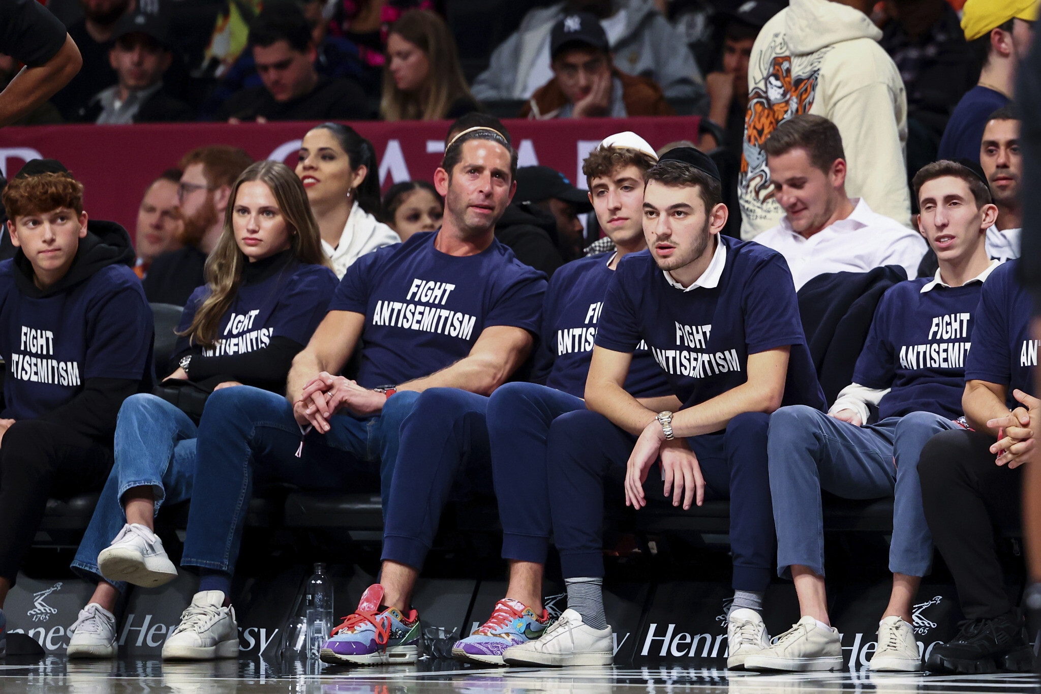 Courtside NBA fans wear 'fight antisemitism' shirts at Kyrie Irving game