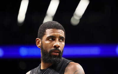 Brooklyn Nets guard Kyrie Irving looks out during the second half of an NBA basketball game against the Indiana Pacers Monday, Oct. 31, 2022, in New York. (AP/Jessie Alcheh)