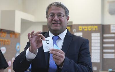 Israeli far-right lawmaker Itamar Ben Gvir shows his ballot in the West Bank settlement of Kiryat Arba during Israeli elections, November 1, 2022. (AP Photo/Tsafrir Abayov)