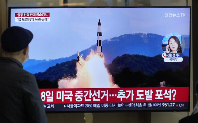 A TV screen shows a file image of North Korea's missile launch during a news program at the Seoul Railway Station in Seoul, South Korea, Wednesday, Nov. 2, 2022. (AP Photo/Ahn Young-joon)