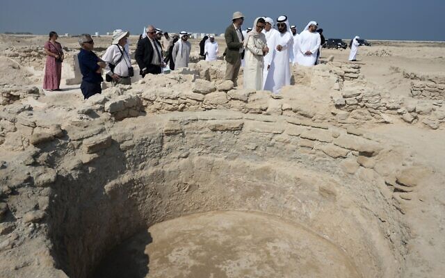 Sheikh Majid bin Saud Al Mualla, chairman of the Umm Al Quwain Department of Tourism and Archaeology, front right, with Noura Al Kaabi, UAE Minister of Culture and Youth, during a visit to the ancient Christian monastery on Siniyah Island in Umm al-Quwain, United Arab Emirates, November 3, 2022. (AP Photo/Kamran Jebreili)