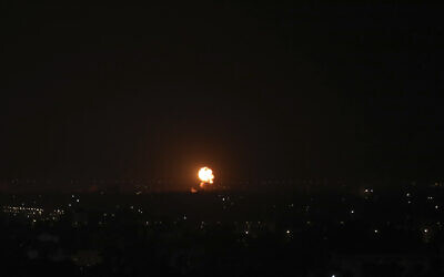 An explosion caused by Israeli airstrikes is seen in Gaza City, November 4, 2022 in response to rocket fire Thursday evening from the Palestinian enclave.  (AP Photo/Ashraf Amra)