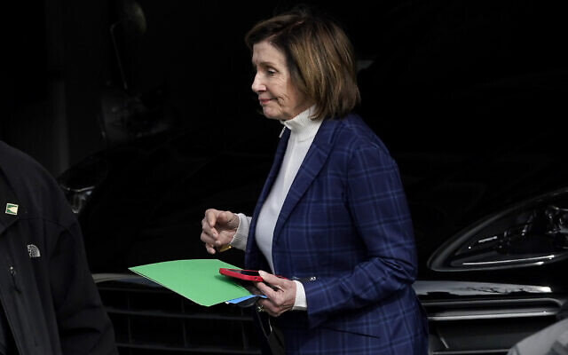 US House Speaker Nancy Pelosi is escorted to a vehicle outside of her home in San Francisco, November 4, 2022. (AP Photo/Jeff Chiu)