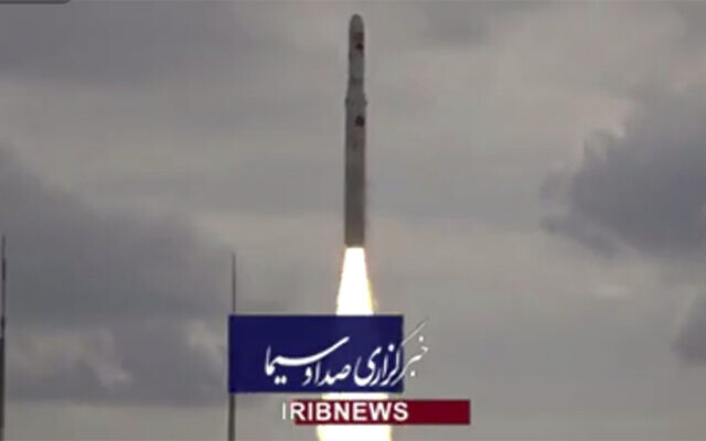 This image taken from video footage aired by Iranian state television, November 5, 2022, shows the launch of a satellite carrier rocket by Iran’s Revolutionary Guard from an undisclosed desert location. (Iranian state television via AP)