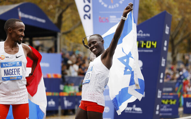 Women's division second place finisher Lonah Chemtai Salpeter, of Israel, reacts at the finish line of the New York City Marathon, November 6, 2022, in New York. (AP Photo/Jason DeCrow)