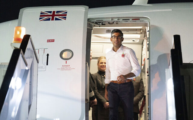Britain's Prime Minister Rishi Sunak arrives in Sharm el-Sheikh, Egypt, to attend the COP27 Climate Summit, November 6, 2022. (Stefan Rousseau/Pool Photo via AP)