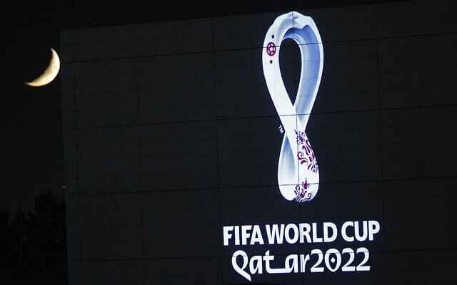 The 2022 Qatar World Cup logo is projected on the opera house of Algiers, September 3, 2019. (AP Photo/Toufik Doudou)
